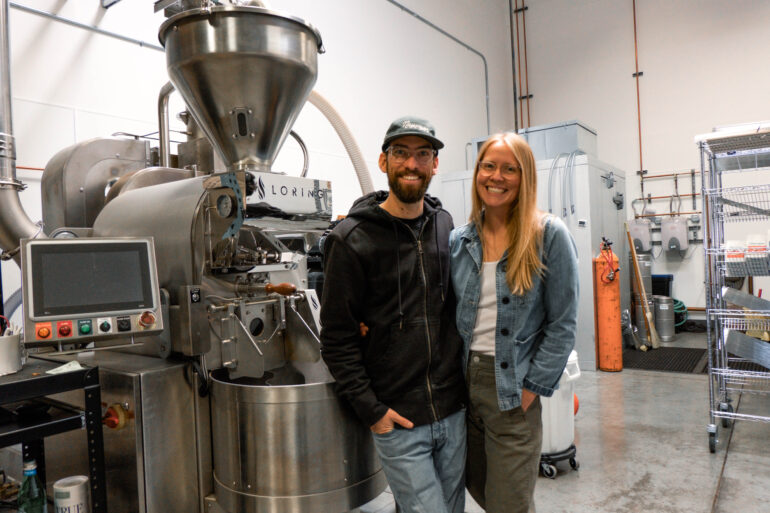 Chris and Beth Vecera of Naysayer Coffee Roasters stand in front of their Loring roaster in their Napa roastery and discuss how to start a coffee roasting business.